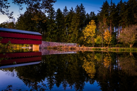 Sach's Covered Bridge reflecting in Marsh Creek at twilight, near Gettysburg, Pennsylvania.