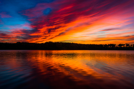 Incredible colorful sunset, at Long Arm Reservoir, near Hanover, Pennsylvania.の写真素材