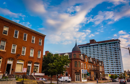 Rowhouses and highrise on Charles Street in Baltimore, Maryland.のeditorial素材