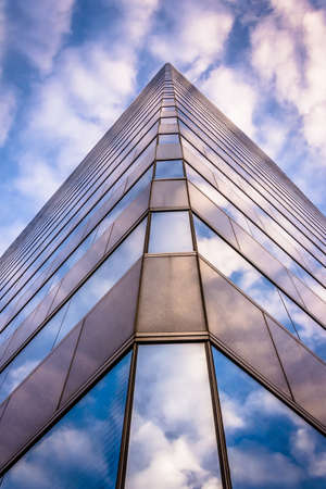 Evening sky reflecting in modern glass architecture at 250 West Pratt Street, in Baltimore,...
