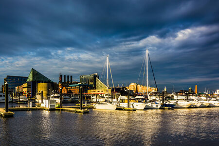Storm clouds over a marina at the Inner Harbor, Baltimore, Maryland.のeditorial素材