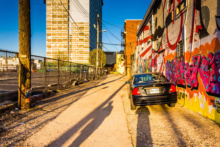 Car parked in Graffiti Alley, Baltimore, Maryland.のeditorial素材
