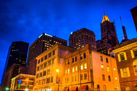 Cluster of buildings at night in downtown Baltimore, Maryland.のeditorial素材
