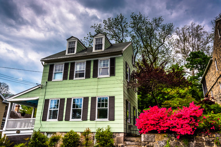 Old house and azalea bushes in Ellicott City, Maryland.のeditorial素材