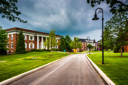 Storm clouds over building and road at Gettysburg College, Pennsylvania.の写真素材
