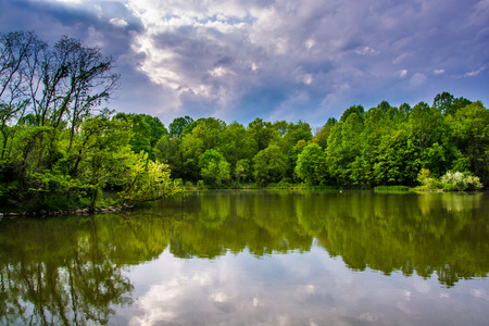Storm clouds over Centennial Lake, at Centennial Park in Columbia, Maryland.の写真素材