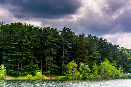 Storm clouds over the shore of Loch Raven Reservoir in Baltimore, Maryland.の写真素材