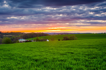 Sunset over farm fields in rural York County, Pennsylvania.の写真素材
