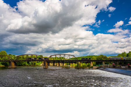 A train bridge and the Delaware River in Easton, Pennsylvania.の写真素材