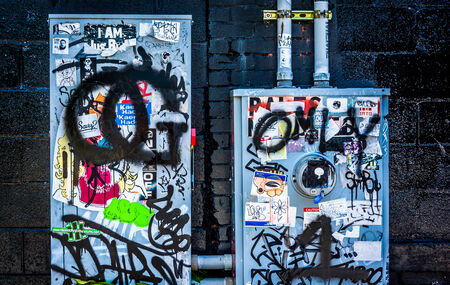 Graffiti and stickers on power meters in Little Five Points, Atlanta, Georgia.のeditorial素材