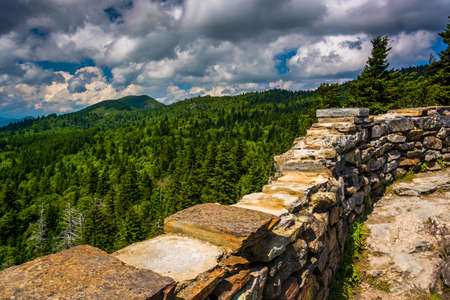 Stone wall and view of the Blue Ridge from Devils Courthouse, near the Blue Ridge Parkway in North Carolina.の写真素材