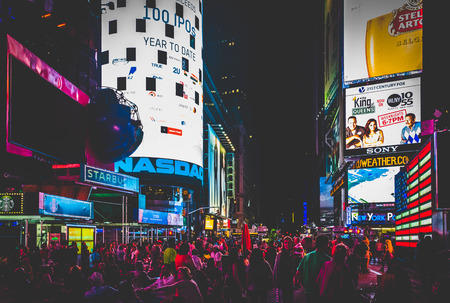 Large crowd of people in Times Square at night, in Midtown Manhattan, New York.のeditorial素材