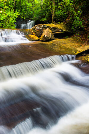 Waterfall and cascades on Carrick Creek, at Table Rock State Park, South Carolina.の写真素材