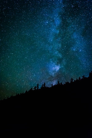 The Milky Way in the night sky at the Sand Beach at Acadia National Park, Maine.の写真素材