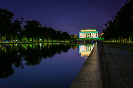 The Lincoln Memorial reflecting in the Reflection Pool at night at the National Mall in Washington, DC.のeditorial素材