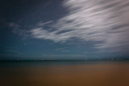 Long exposure of clouds and stars in the sky over the Gulf of Mexico in Key West, Florida.の写真素材