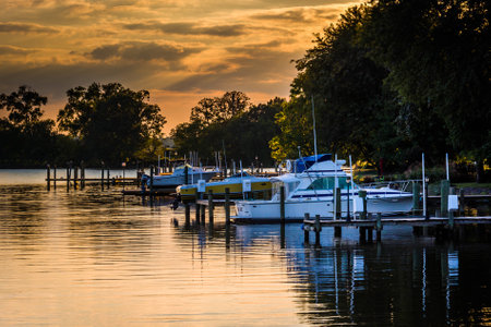 Sunset over boats docked in Duck Creek in Essex, Maryland.のeditorial素材