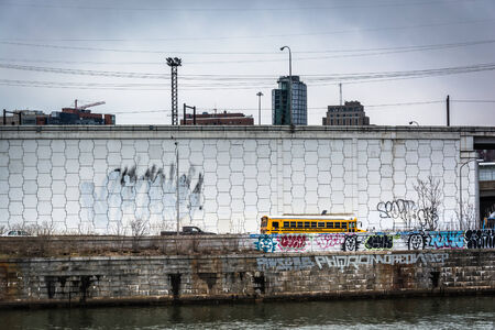 Graffiti on wall along the Schuylkill River in Philadelphia, Pennsylvania.のeditorial素材