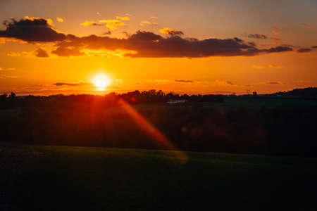 Sunset over fields and hills in rural York County, Pennsylvaniaの写真素材