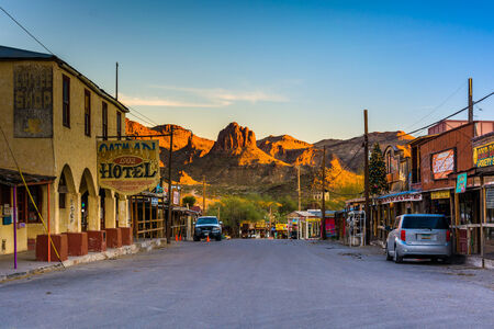Buildings and view of distant mountains on Main Street, in Oatman, Arizona.のeditorial素材