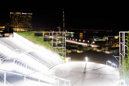 Staircase and view of the waterfront at night at the Convention Center in San Diego, California.の写真素材
