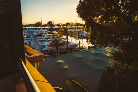 View of a marina at sunset, at the Embarcadero, in San Diego, California.の写真素材