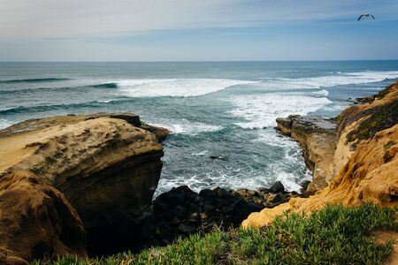 Cliffs along the Pacific Ocean at Sunset Cliffs Natural Park in Point Loma, California.の写真素材