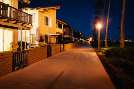 Buildings along the Oceanfront Boardwalk at night, in Newport Beach, California.の写真素材