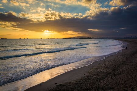 Sunset over the beach and Pacific Ocean, in Seal Beach, California.