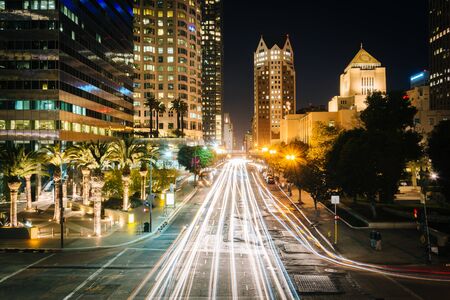 Long exposure of traffic and buildings along 5th Street at night, in downtown Los Angeles, California.のeditorial素材