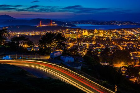 Twin Peaks Boulevard and view of San Francisco at night, from Twin Peaks, in San Francisco, California.の写真素材