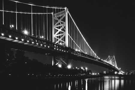 Black and white photo of the Benjamin Franklin Bridge at night, in Philadelphia, Pennsylvania.の写真素材