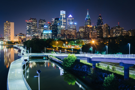 The skyline and Schuylkill Banks Boardwalk seen at night from the South Street Bridge over the Schuylkill River, in Philadelphia, Pennsylvania.のeditorial素材