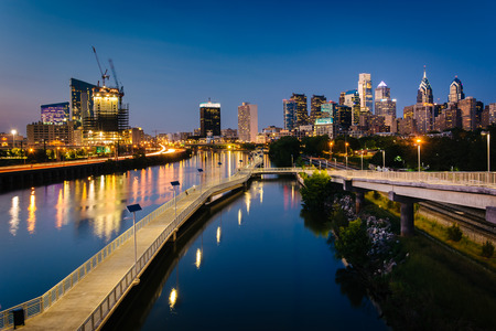 The skyline and Schuylkill Banks Boardwalk seen at night from the South Street Bridge over the Schuylkill River, in Philadelphia, Pennsylvania.のeditorial素材