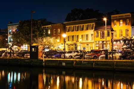 Shops and restaurants at night in Fells Point, Baltimore, Maryland.のeditorial素材