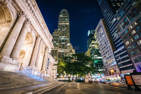 The New York Public Library and skyscrapers at night, in Midtown Manhattan, New York.のeditorial素材