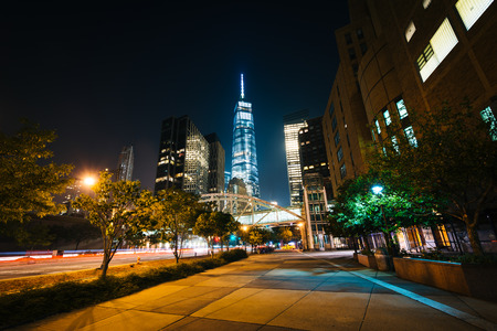 Walkway and buildings in Lower Manhattan at night, New York.