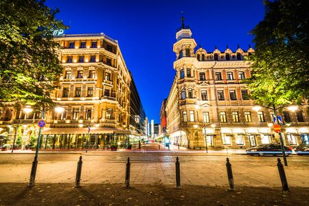 Buildings along Norra Esplanaden at night, in Helsinki, Finland.のeditorial素材