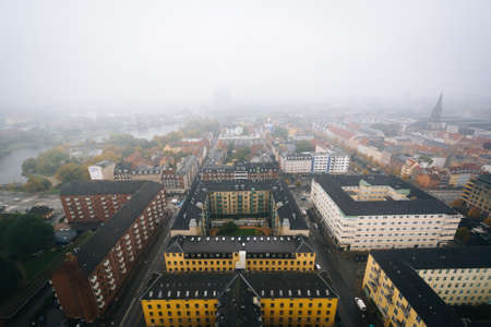 Foggy view from the tower of the Church of Our Saviour, in Christianshavn, Copenhagen, Denmark.のeditorial素材