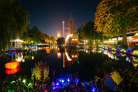 The lake at Tivoli Gardens at night, in Copenhagen, Denmark.のeditorial素材