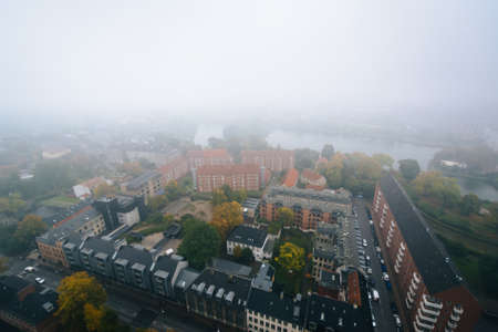 Foggy view from the tower of the Church of Our Saviour, in Christianshavn, Copenhagen, Denmark.の写真素材