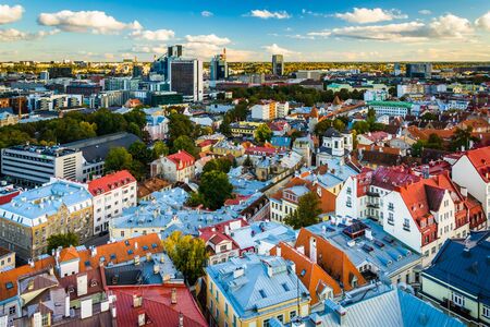 View of the Old Town and distant modern buildings from St. Olaf's Church Tower in Tallinn, Estonia.のeditorial素材