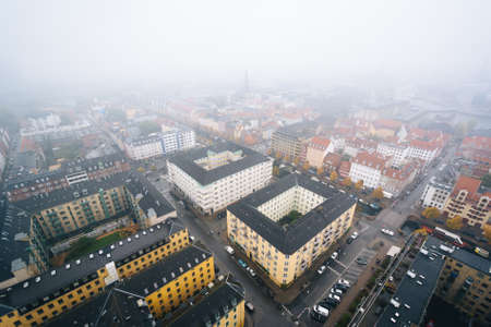 Foggy view from the tower of the Church of Our Saviour, in Christianshavn, Copenhagen, Denmark.の写真素材