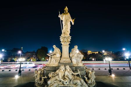 Statue outside the Austrian Parliament Building at night, in Vienna, Austria.の写真素材