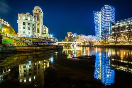 Buildings along the Danube Canal at night, in Vienna, Austria.のeditorial素材