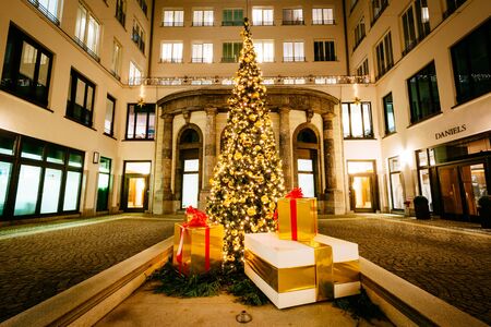 Christmas tree and buildings at night, in Munich, Germany.のeditorial素材