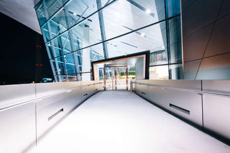 Walkway and exterior of BMW Welt at night, in Munich, Germany.のeditorial素材