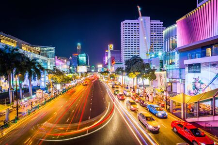 Long exposure of traffic and modern buildings on Ratchadamri Road at night, at Siam, in Bangkok, Thailand.のeditorial素材
