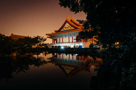 The National Concert Hall and a pond at night, at Taiwan Democracy Memorial Park, in Taipei, Taiwan.のeditorial素材
