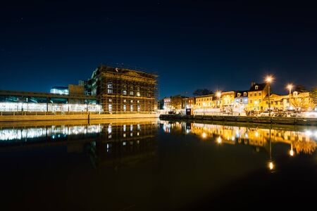 Buildings on the waterfront in Fells Point at night, in Baltimore, Maryland.